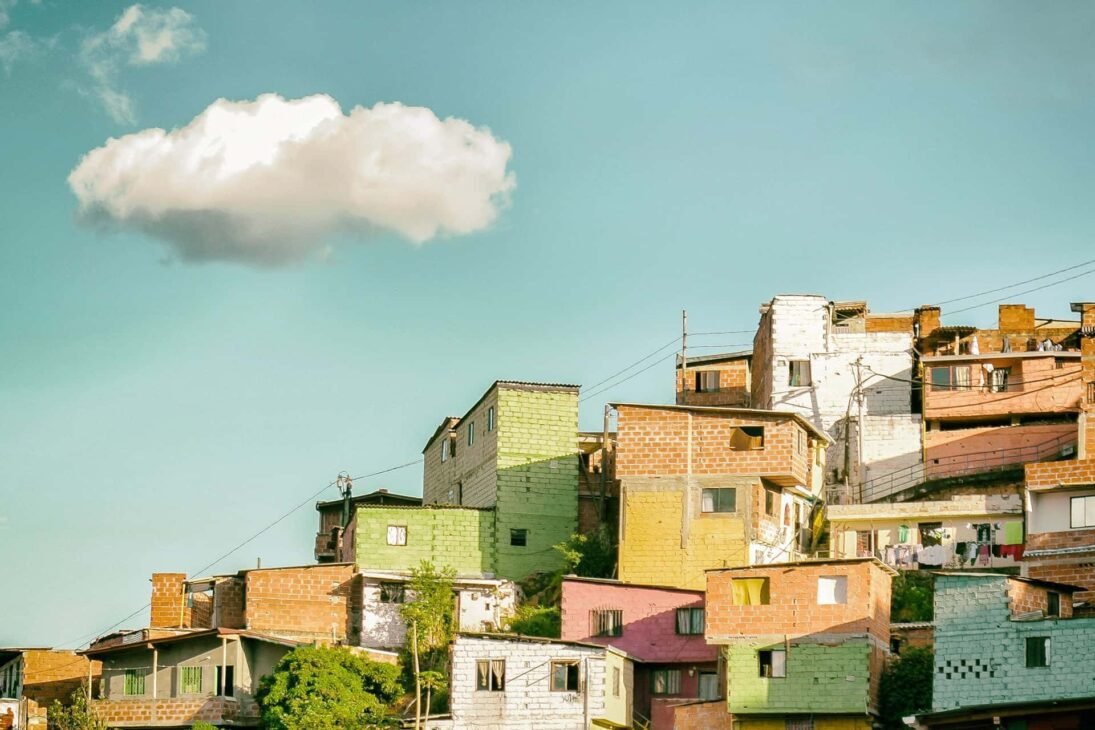 a group of multicolored buildings on a hill