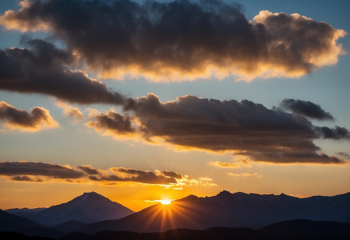 A sunset over mountains and cloudsDescription automatically generated