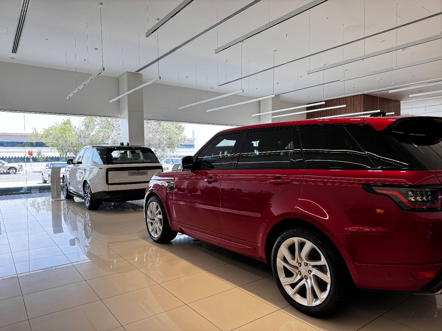 Car Insurance Dubai : A red car parked in a showroom