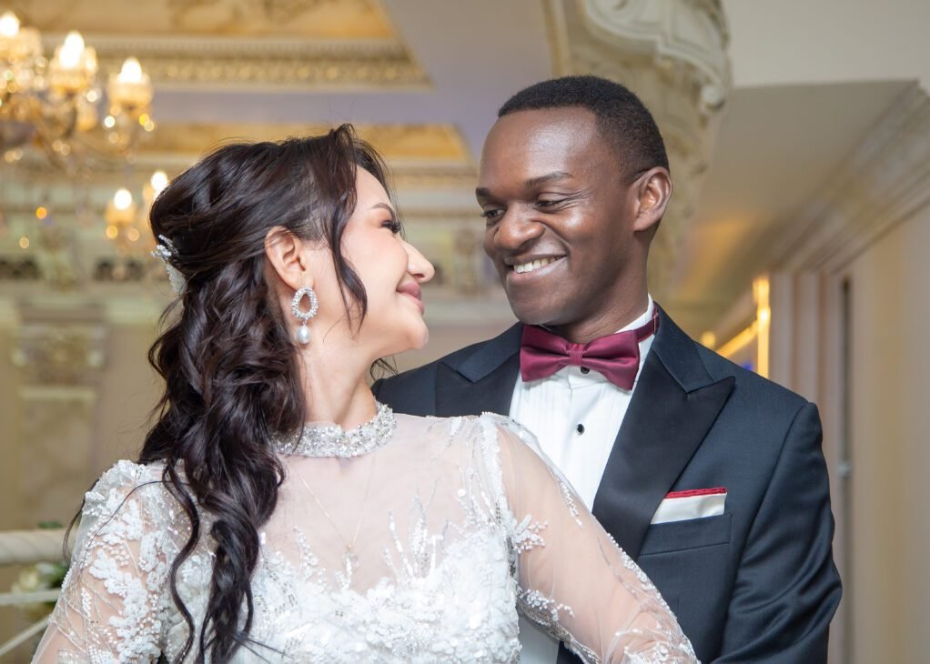 a man and woman smiling at each other