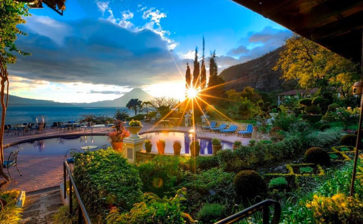 a pool with a swimming pool and a mountain in the background