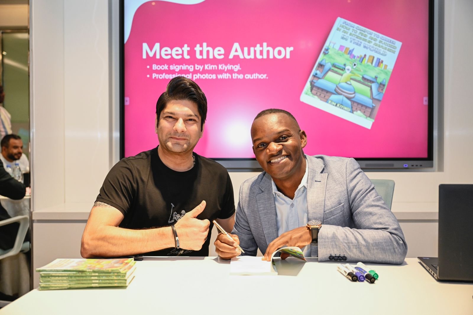 two men sitting at a table