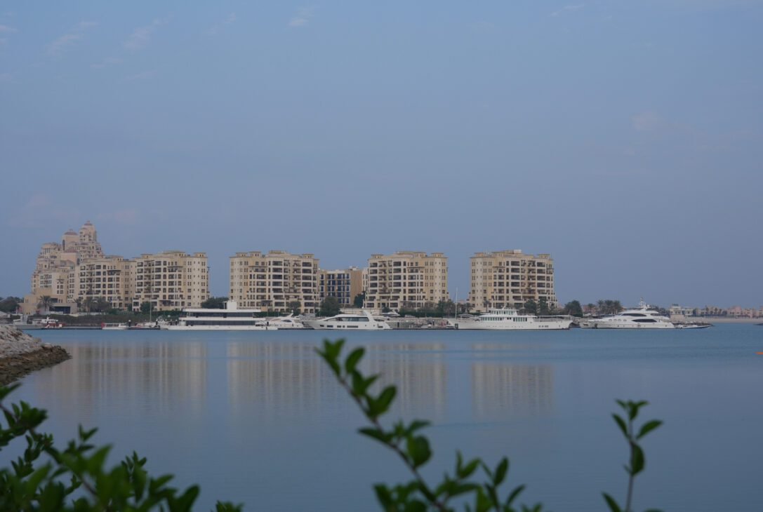 a group of buildings on a body of water