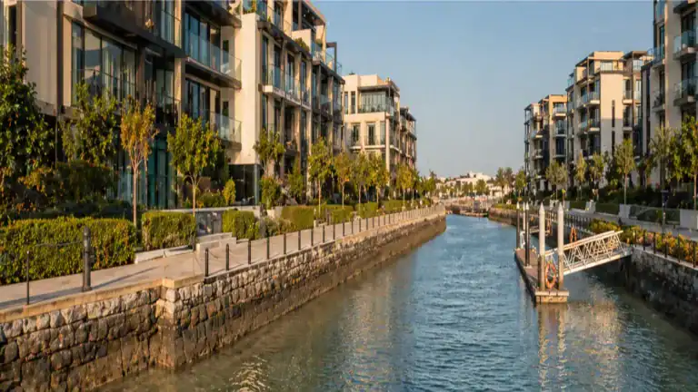 Water's Edge Yas Island waterfront apartments and canal promenade